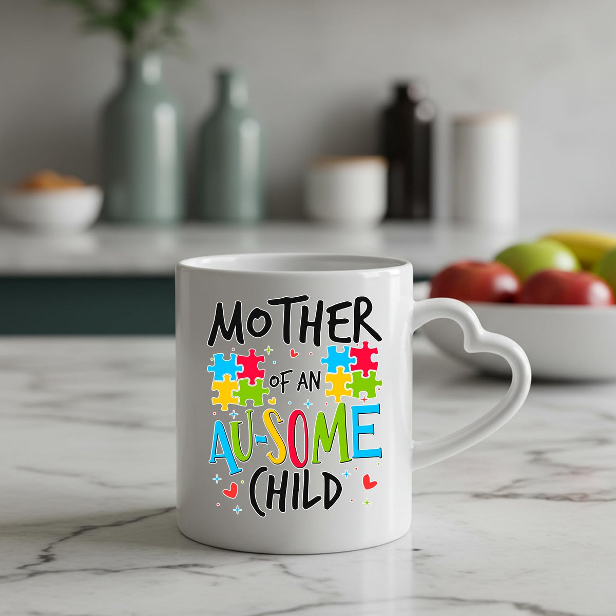 Mother of an Au-Some Child heart-handle mug on a marble counter with fruit