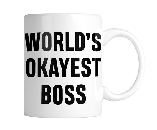 White mug with “World's Okayest Boss” in bold black lettering, handle on the right
