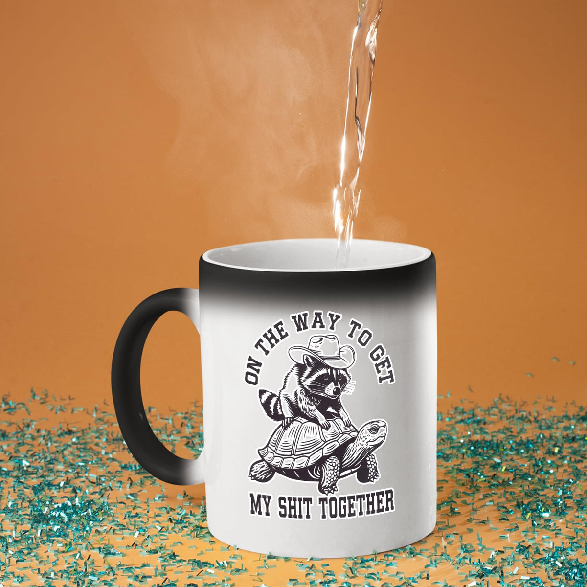 Hot water poured into the raccoon and tortoise colour changing mug as the design appears