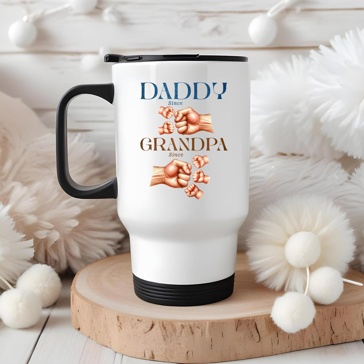 Daddy and Grandpa fist bump travel mug on a wooden slice with white pom-poms