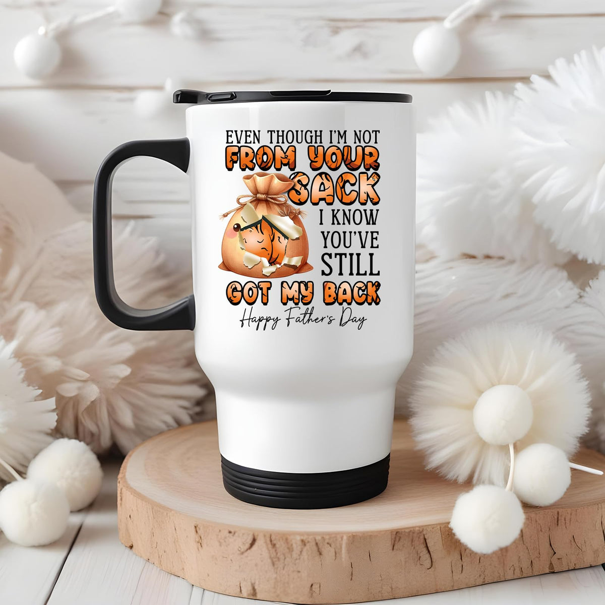 Not From Your Sack travel mug on a wooden slice with white pom-poms