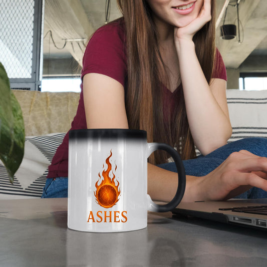 Woman with the Ashes colour changing mug at a laptop