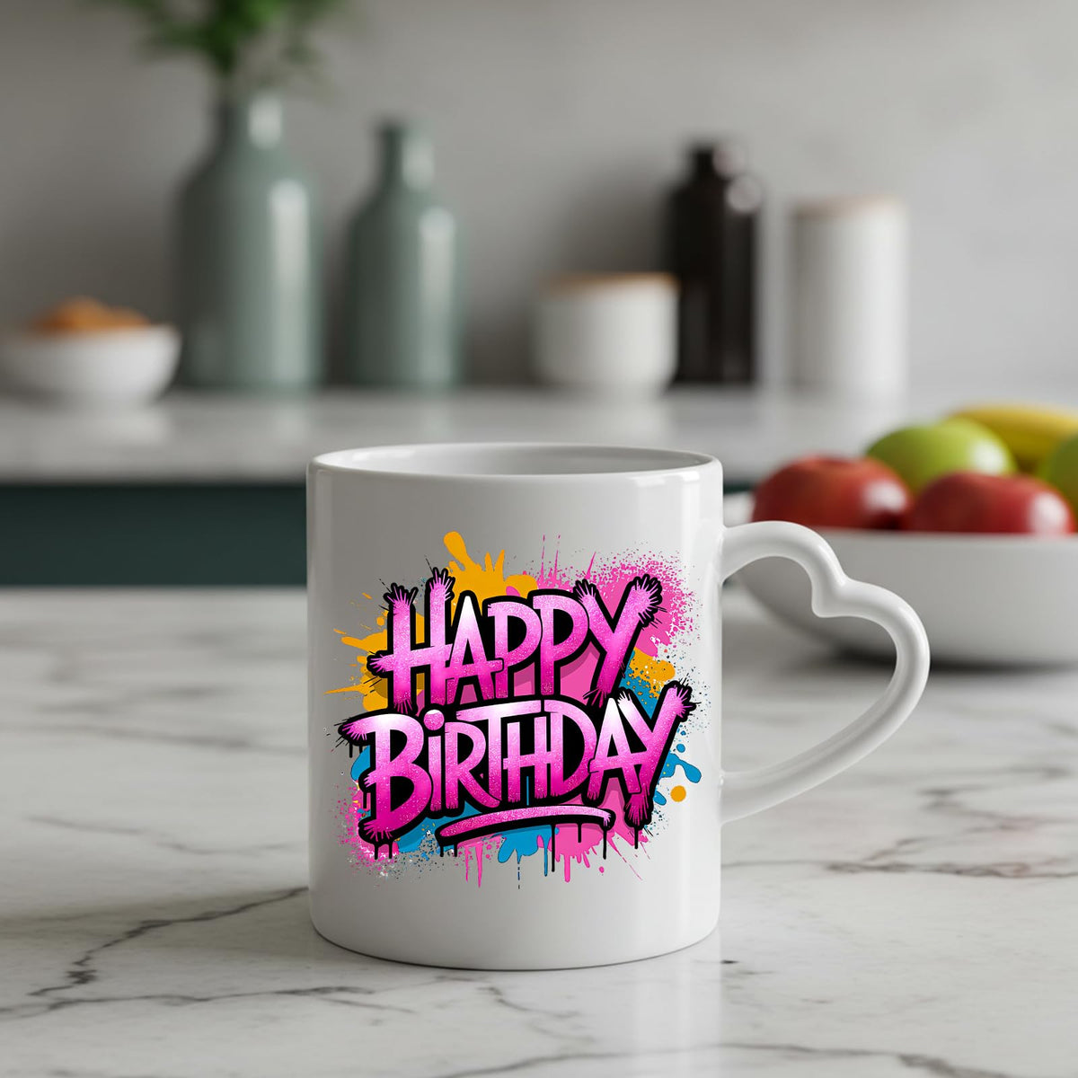 Happy Birthday pink graffiti splash heart-handle mug on a marble counter with fruit