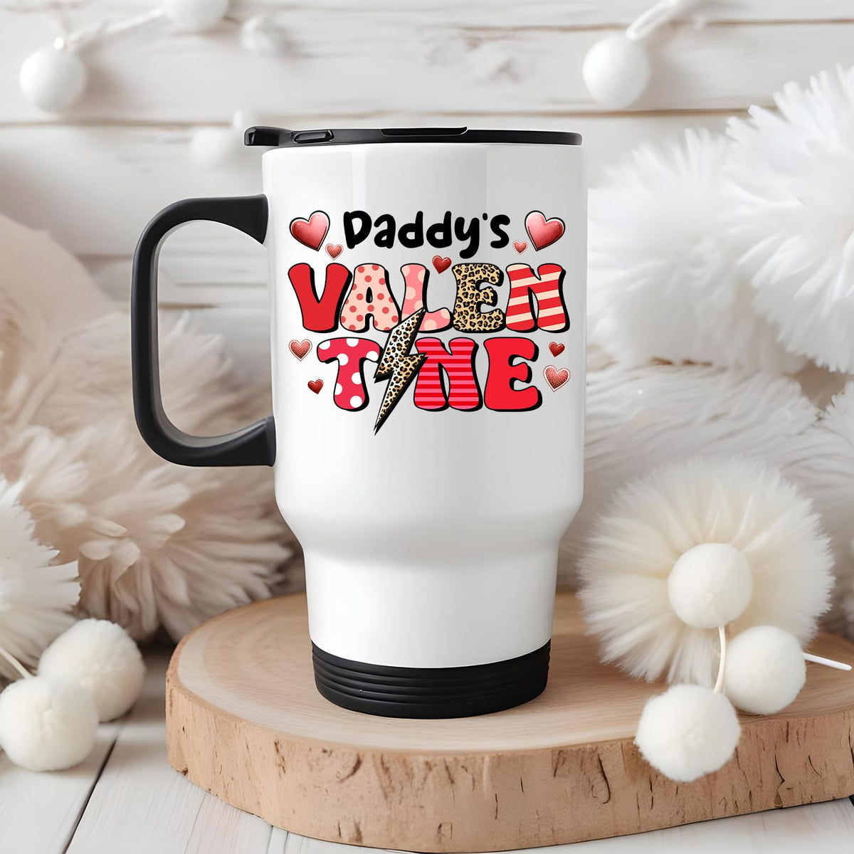 Daddy’s Valentine travel mug on a wooden slice with white pom-poms