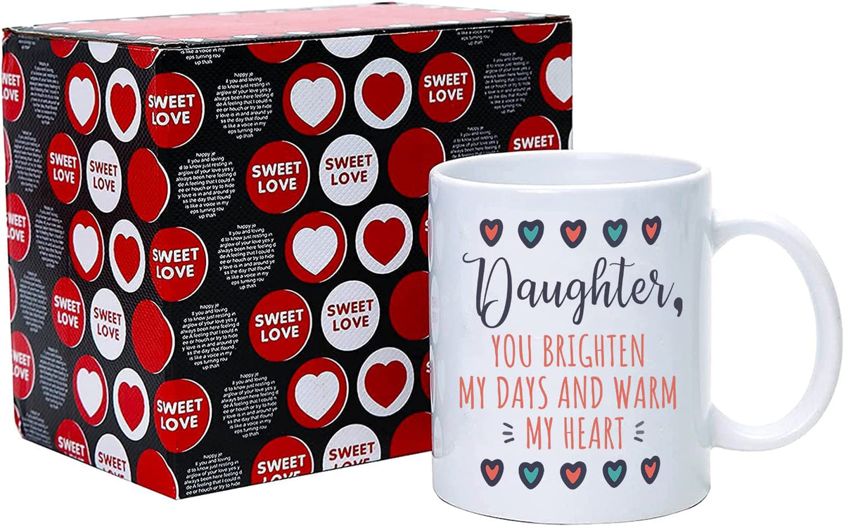 Daughter mug next to a heart-patterned gift box