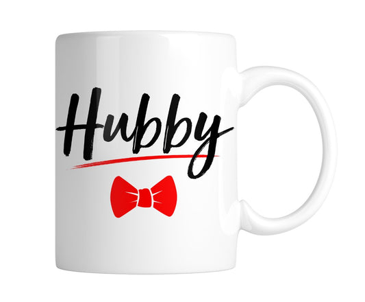 White mug with “Hubby” in black script with a red bow tie, handle on the right