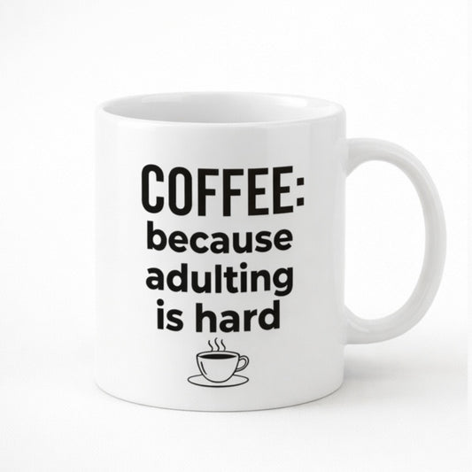 White mug printed “Coffee: Because Adulting Is Hard”