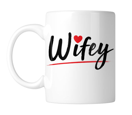 White mug with “Wifey” in black script with a little red heart, handle on the left