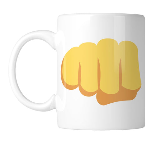 White mug with a big fist-bump emoji in bright yellow, handle on the left