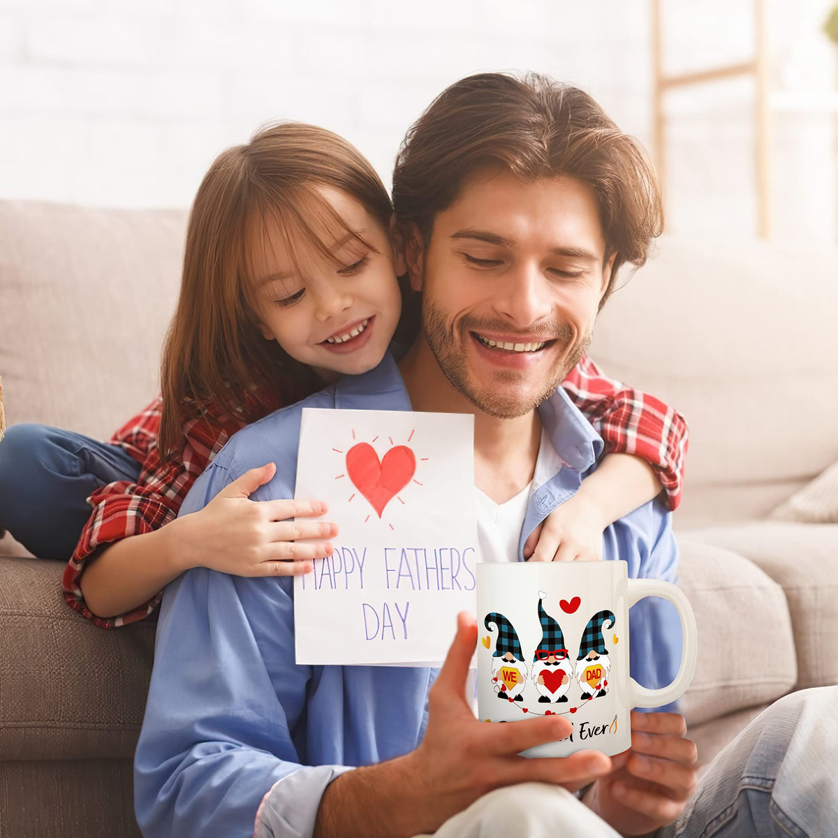 Father and daughter with the Best Dad Ever mug and a card