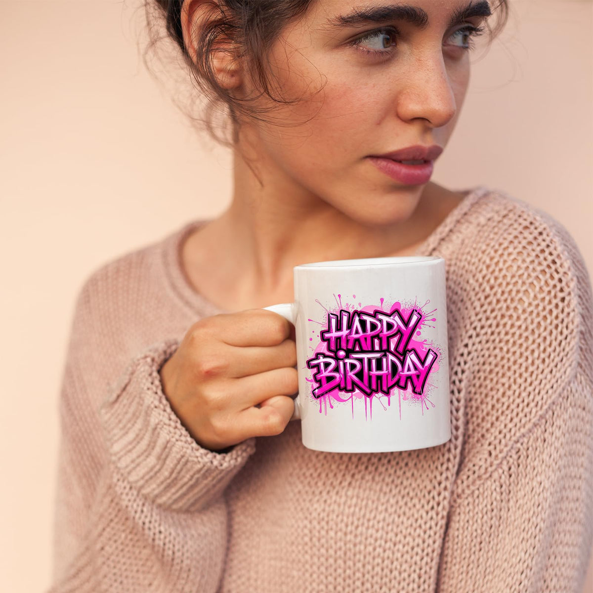Woman sipping from the Happy Birthday mug