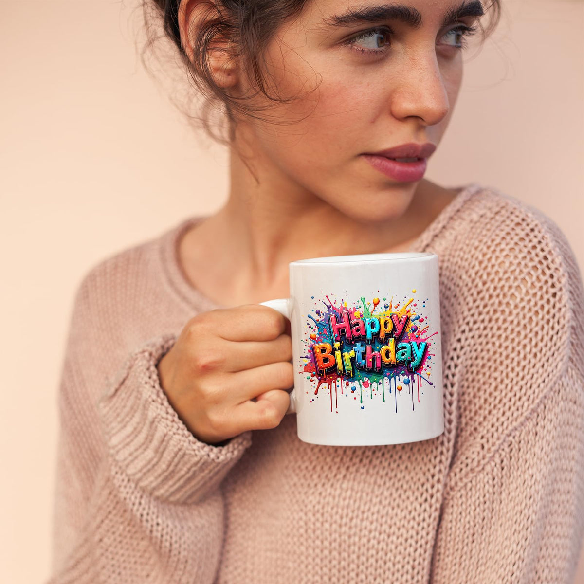 Woman sipping from the Happy Birthday mug
