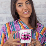 Woman in a striped shirt holding the colour handle mug