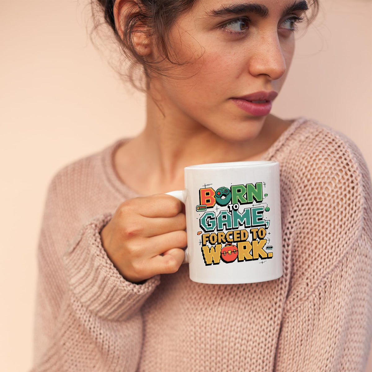 Woman sipping from the Born to Game mug