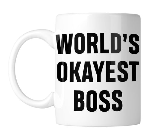 White mug with “World's Okayest Boss” in bold black lettering, handle on the left