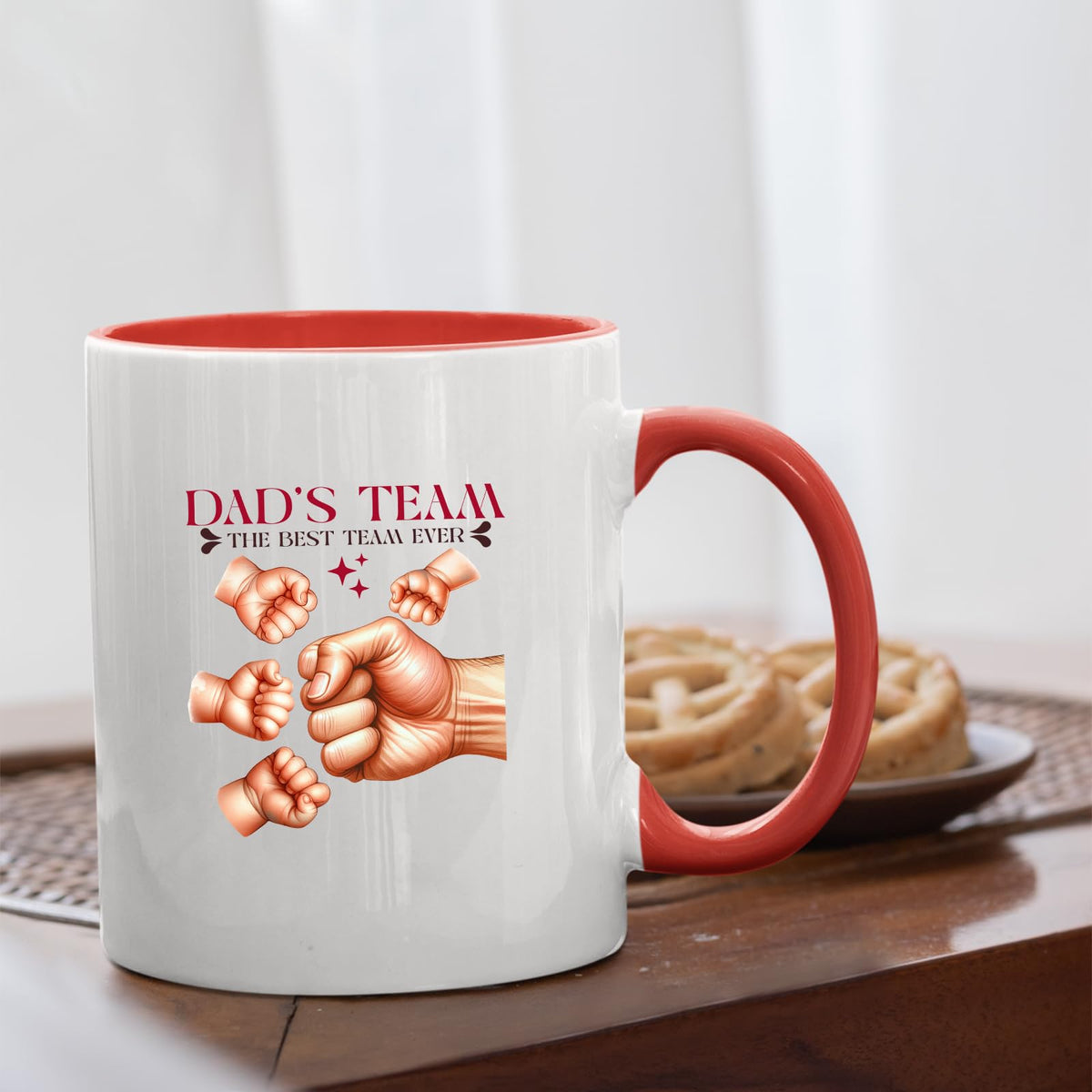 Dad’s Team fist bump mug with a red handle beside biscuits