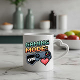 Gaming Mode On heart-handle mug on a marble counter with fruit