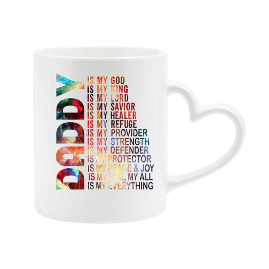 White heart-handle mug with a colourful vertical “DADDY” beside “is my God, my King, my Lord… is my everything”