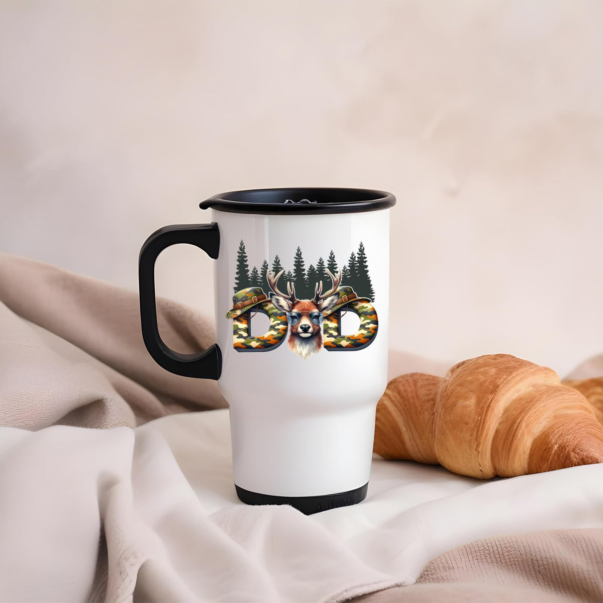 Hunting Dad deer travel mug on a soft blanket beside a croissant