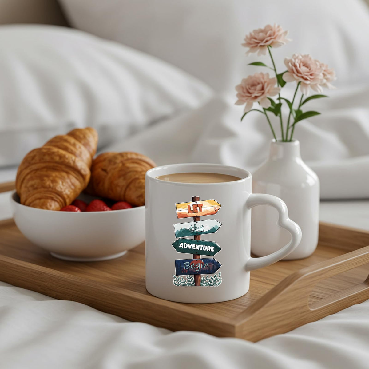 Let the Adventure Begin heart-handle mug on a breakfast tray with croissants and flowers