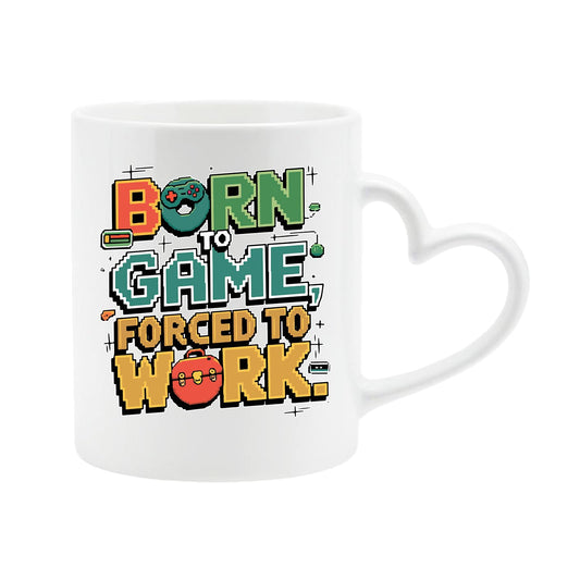 White heart-handle mug with “Born to game, forced to work” in colourful arcade lettering