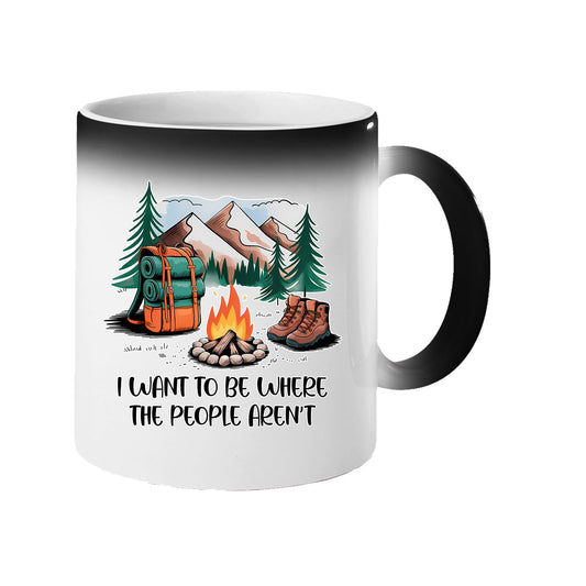 Colour changing mug revealing a campfire, backpack, boots and mountains with “I want to be where the people aren’t”