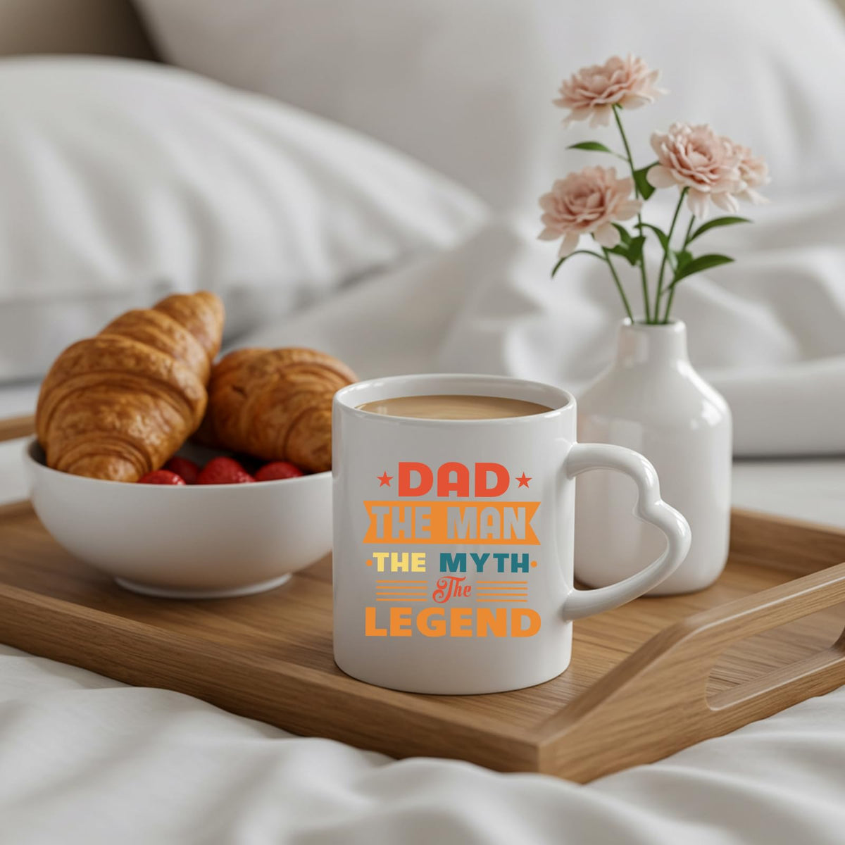 Dad the Man retro heart-handle mug on a breakfast tray with croissants and flowers