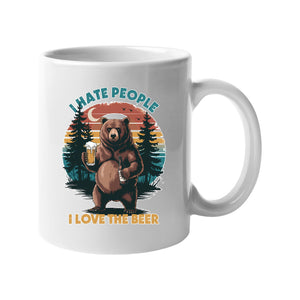 White mug with a bear holding a beer against a retro forest sunset with “I hate people, I love the beer”