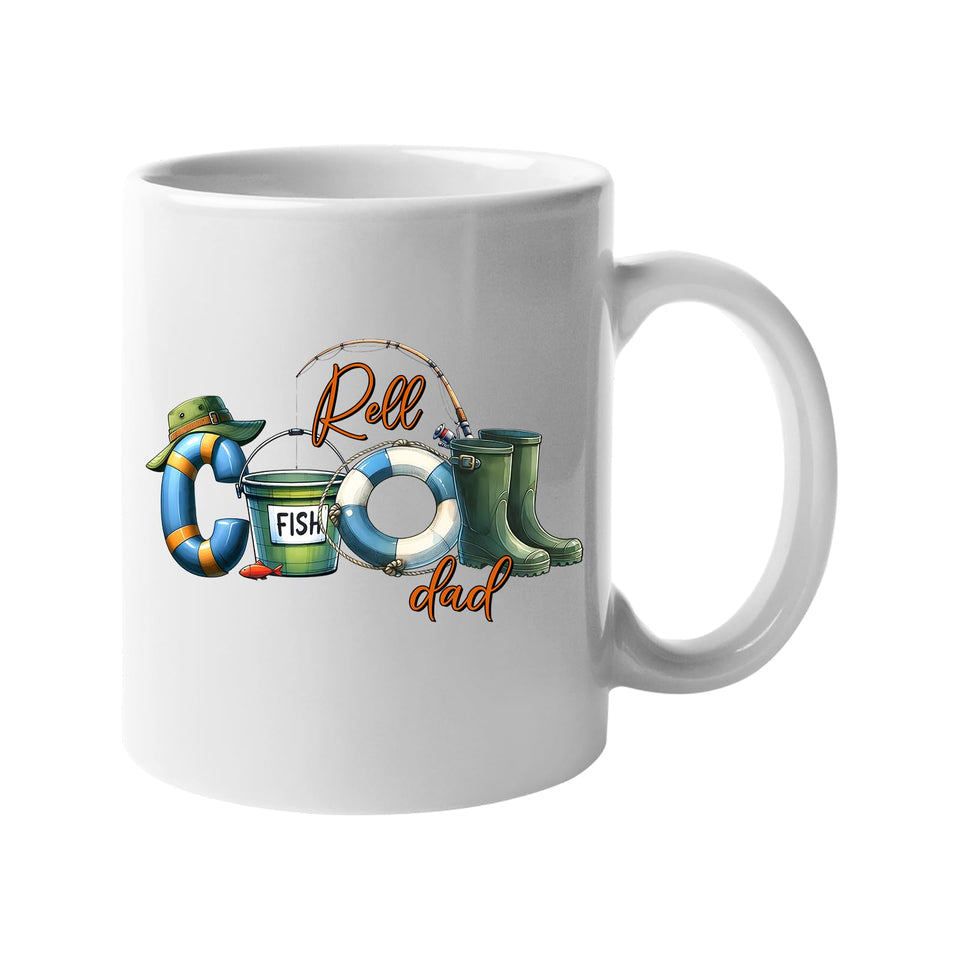 White mug with “Reel COOL Dad” spelled out with a bucket hat, bait tin, float and wellies