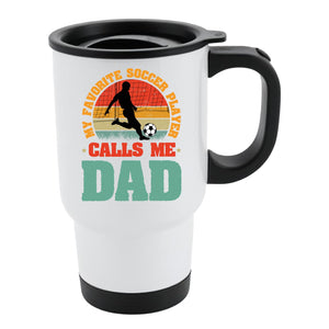 White travel mug with black lid and a footballer in silhouette on a retro sunset with “My favorite soccer player calls me Dad”
