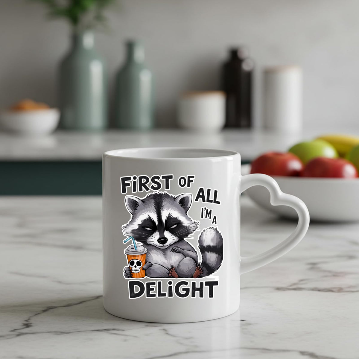 First of All I’m a Delight raccoon heart-handle mug on a marble counter with fruit