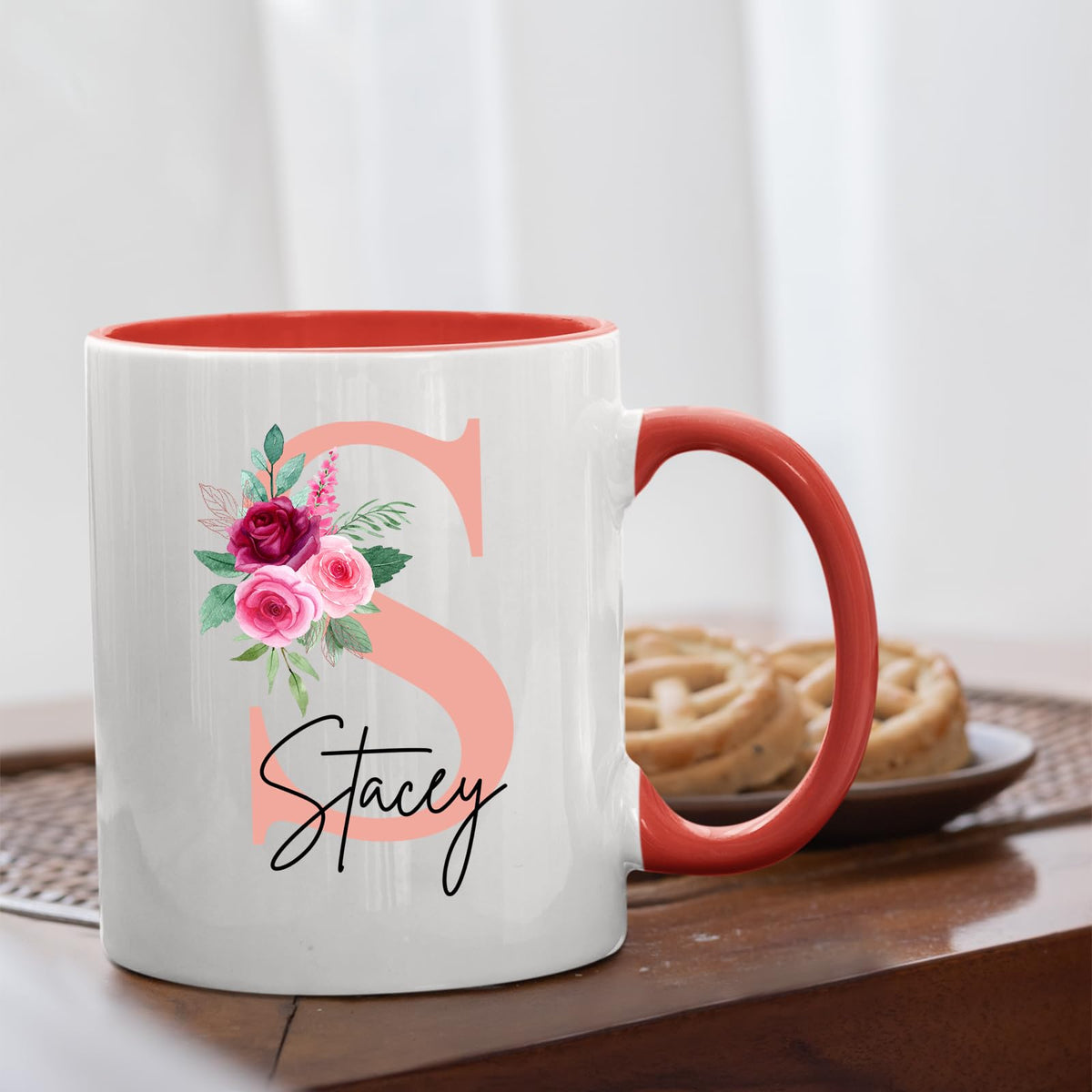 Red handle mug with a blush pink initial with roses and an example name on a table