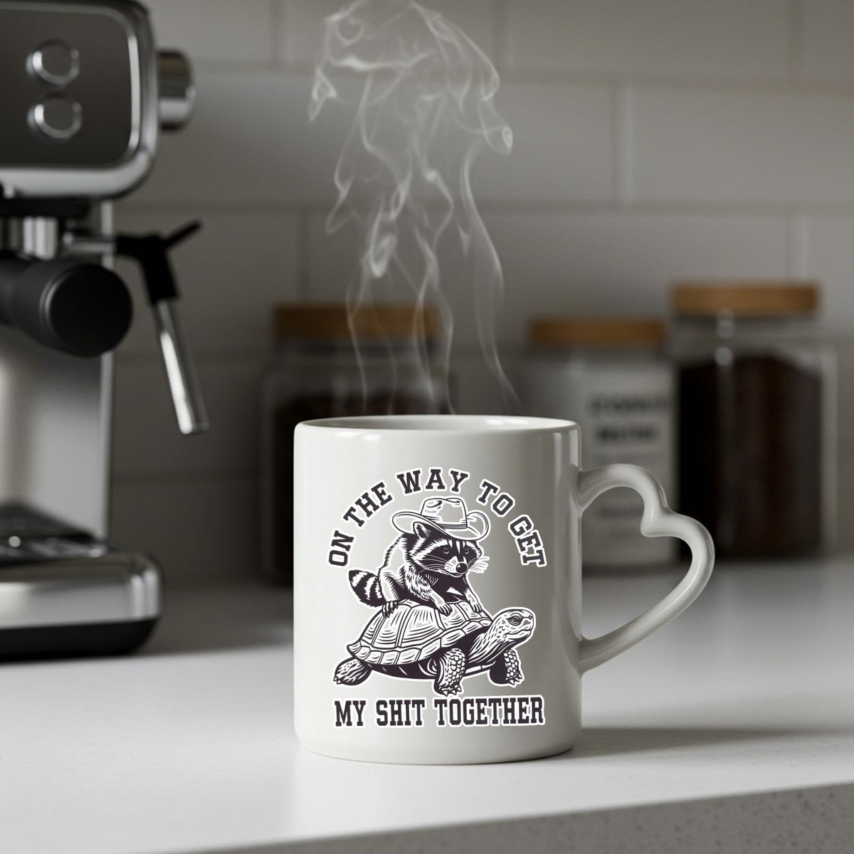 Steaming raccoon and tortoise heart-handle mug on a kitchen counter