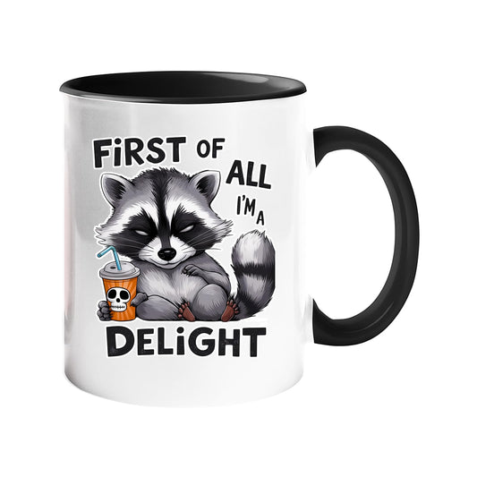 Colour handle mug with a grumpy raccoon with a skull cup and “First of all, I’m a delight” – black handle and inside