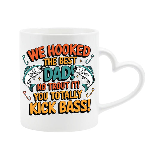 White heart-handle mug with two leaping fish and “We hooked the best Dad! No trout about it! You totally kick bass!”