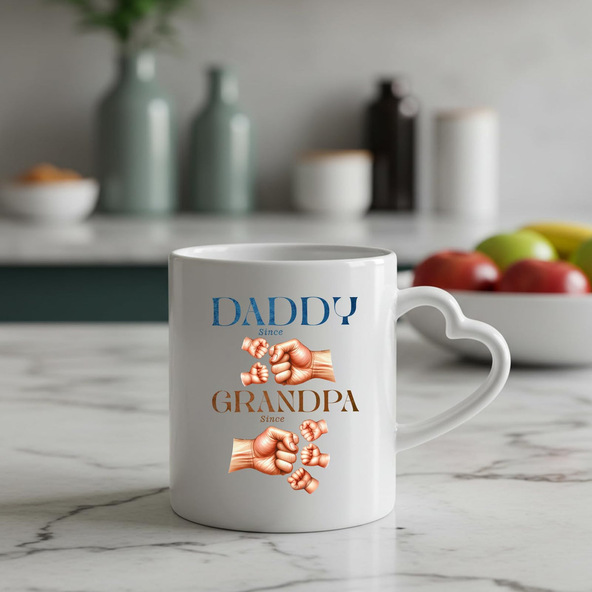 Daddy and Grandpa fist bump heart-handle mug on a marble counter with fruit