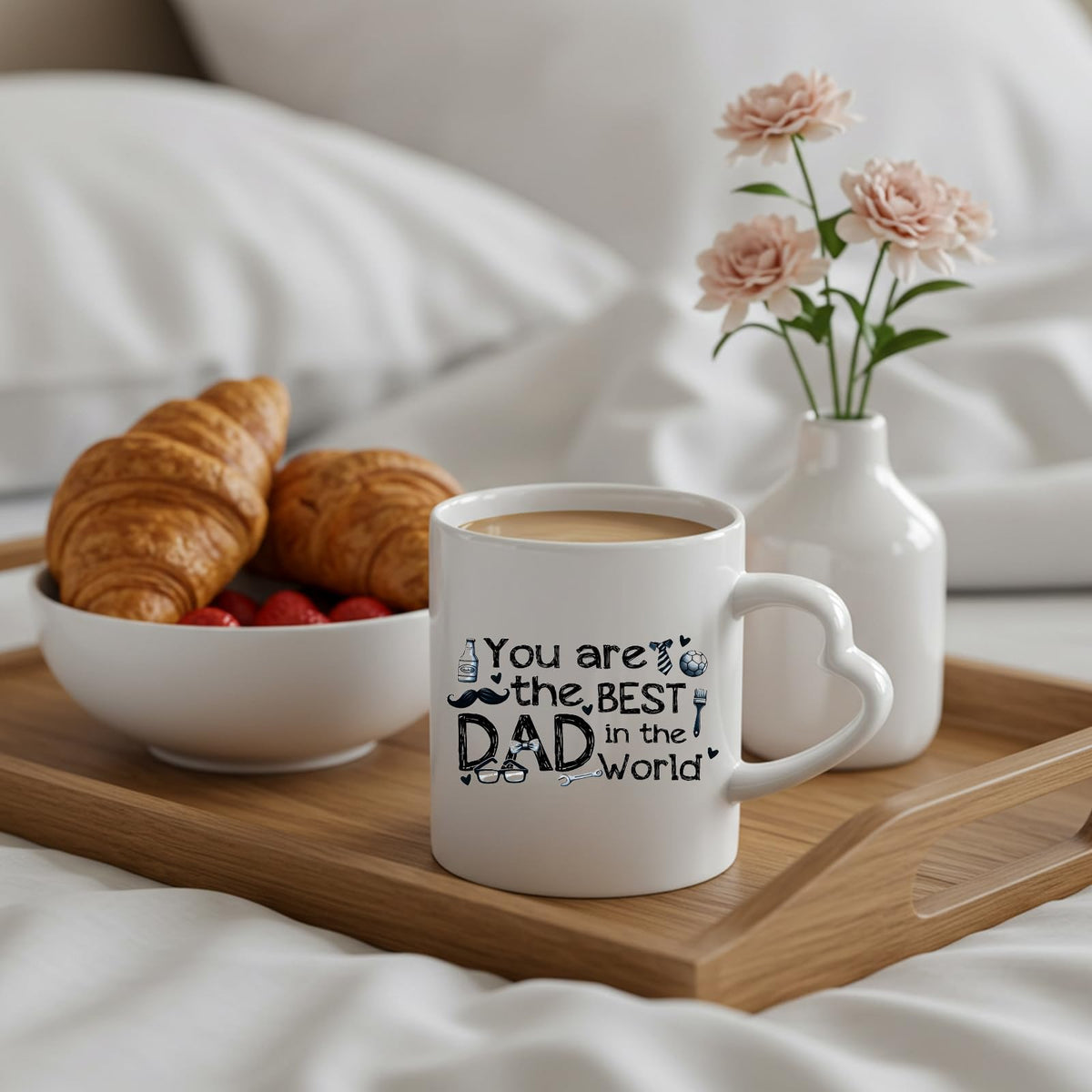 Best Dad in the World sketch heart-handle mug on a breakfast tray with croissants and flowers