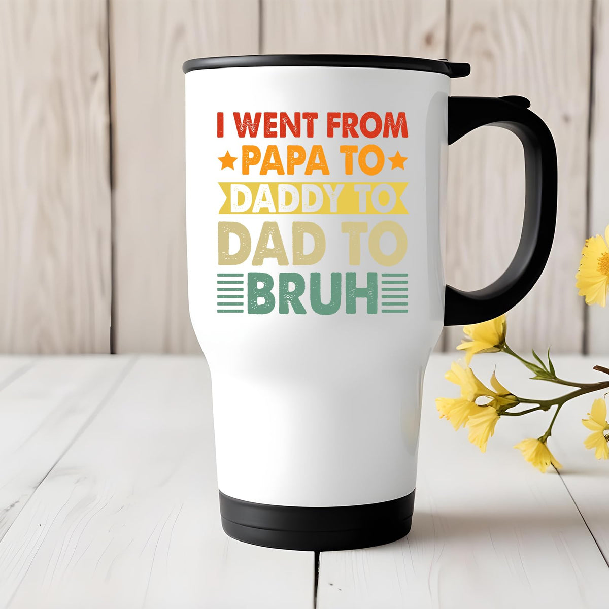 Papa to Bruh travel mug on a white wooden table with yellow flowers