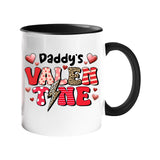 Colour handle mug with “Daddy’s Valentine” in patterned letters with hearts and a leopard lightning bolt – black handle and inside