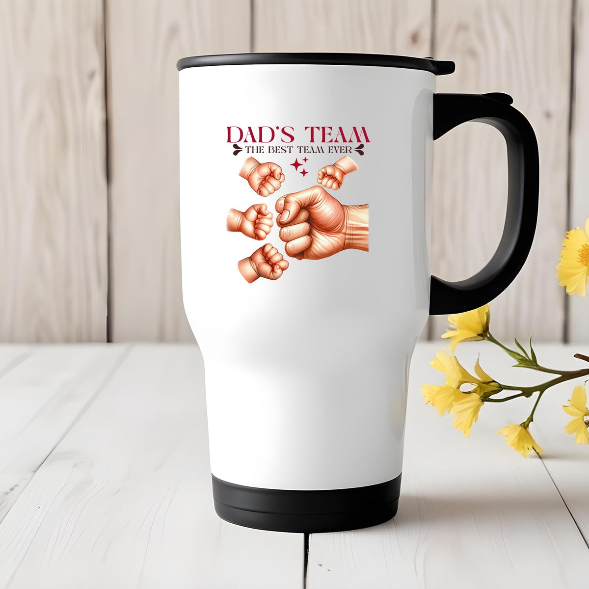 Dad’s Team fist bump travel mug on a white wooden table with yellow flowers