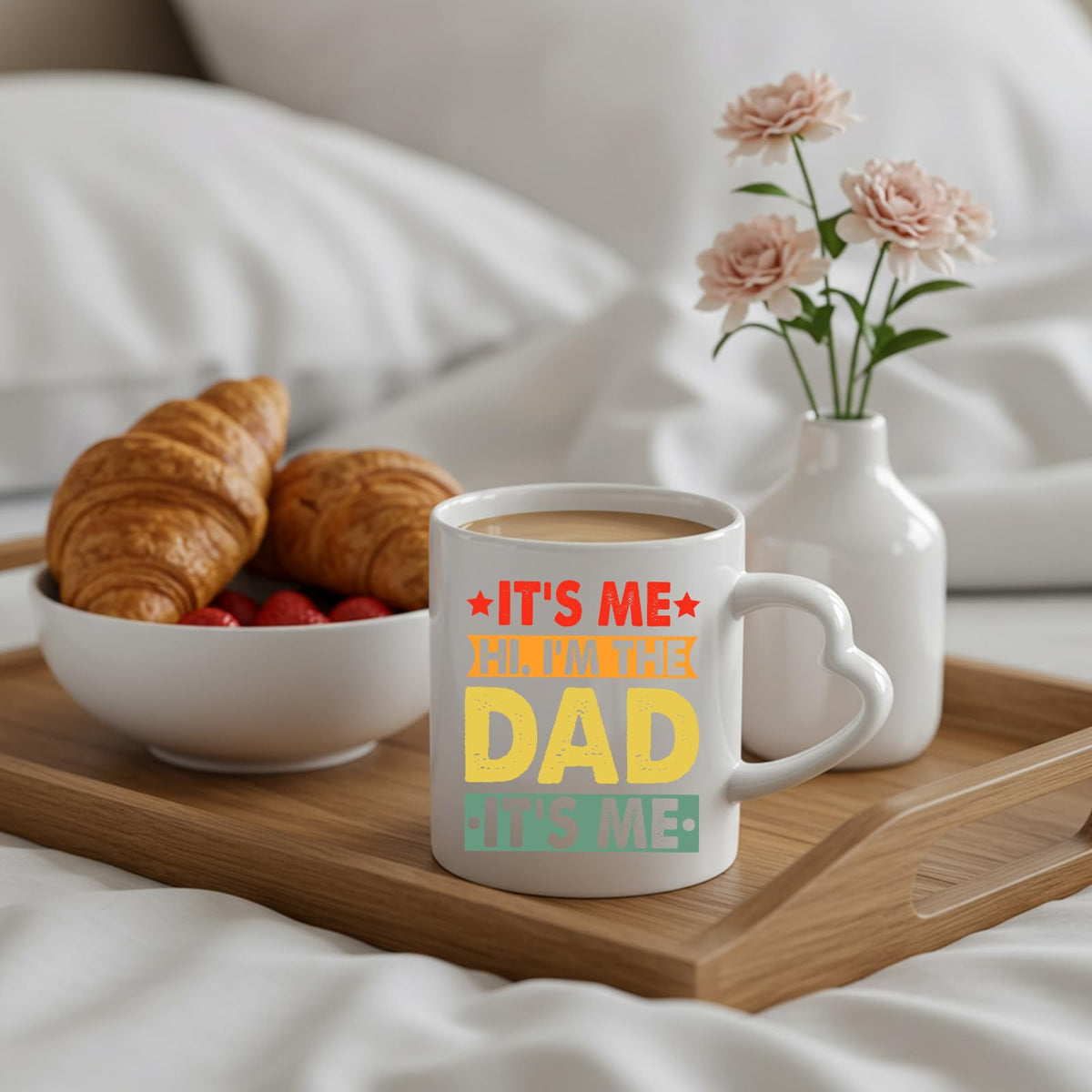 It’s Me Hi I’m the Dad heart-handle mug on a breakfast tray with croissants and flowers