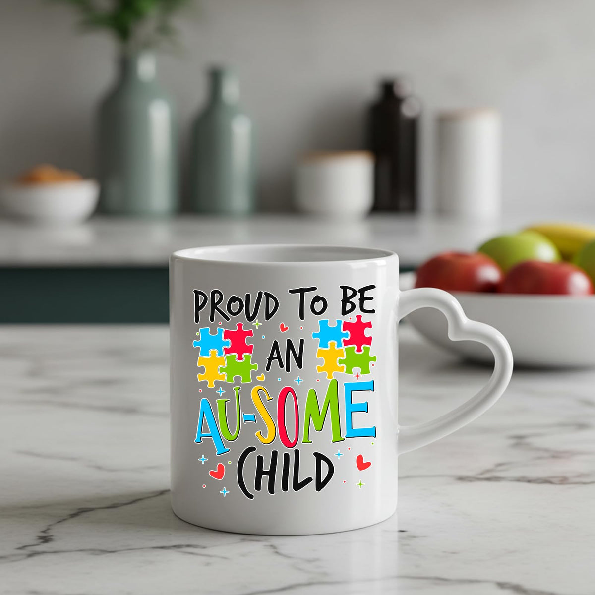Proud to Be an Au-Some Child heart-handle mug on a marble counter with fruit