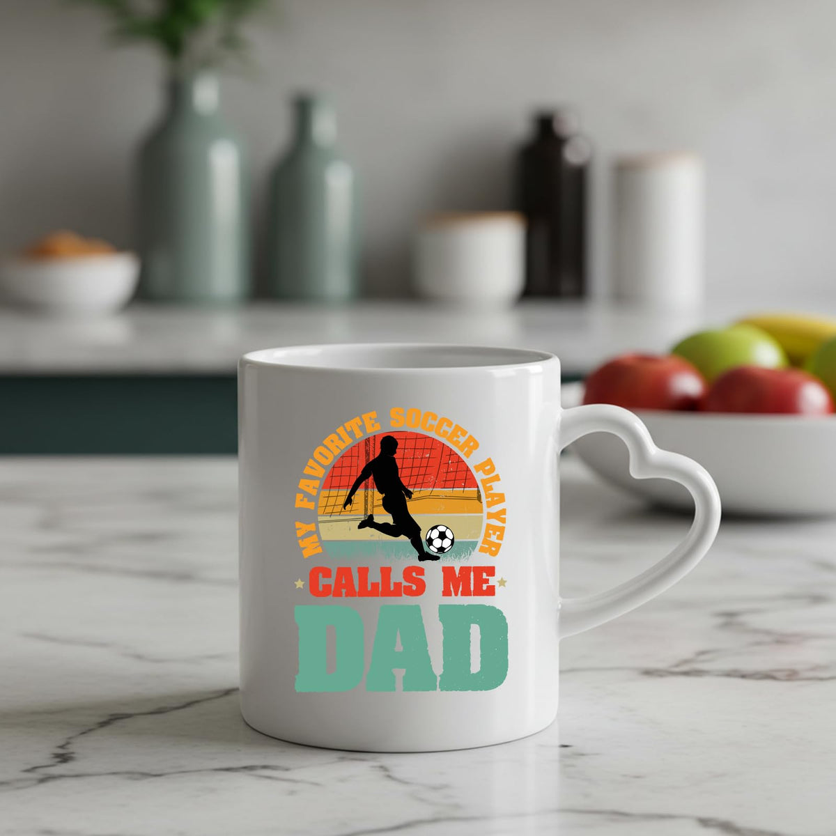 Soccer Dad heart-handle mug on a marble counter with fruit