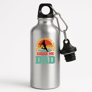Silver aluminium water bottle with a footballer in silhouette on a retro sunset with “My favorite soccer player calls me Dad”