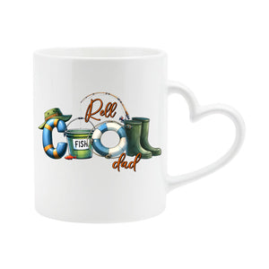 White heart-handle mug with “Reel COOL Dad” spelled out with a bucket hat, bait tin, float and wellies