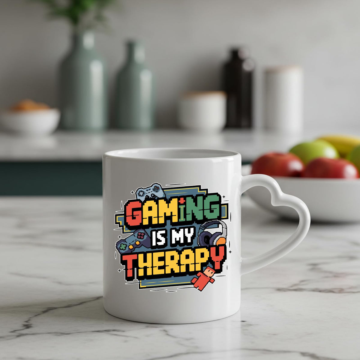 Gaming Is My Therapy heart-handle mug on a marble counter with fruit