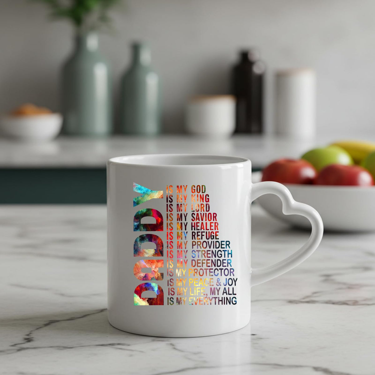 Daddy Is My God heart-handle mug on a marble counter with fruit