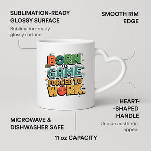 Born to Game heart-handle mug on a marble counter with fruit