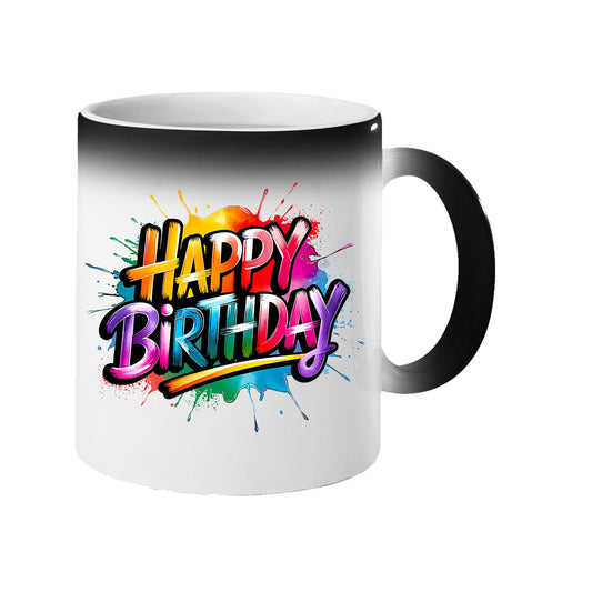 Colour changing mug revealing “Happy Birthday” in bold rainbow letters on a colourful paint splash
