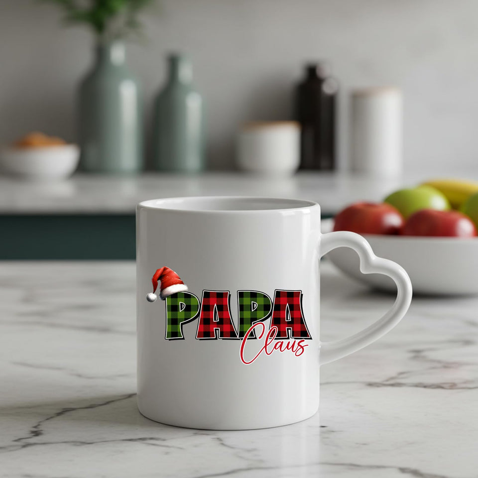 Papa Claus heart-handle mug on a marble counter with fruit